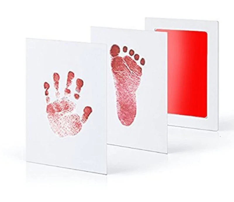 Red hand and footprints on white cards with a red light on a white background