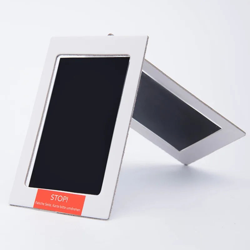 Digital photo frame with 'STOP!' label on a white background